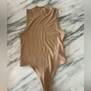Tan body suit